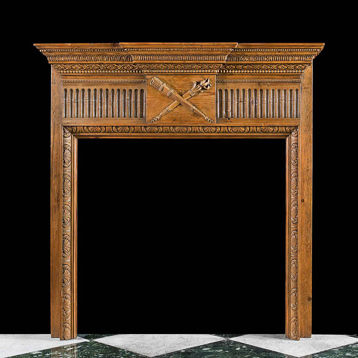 A small carved pine Antique fireplace surround