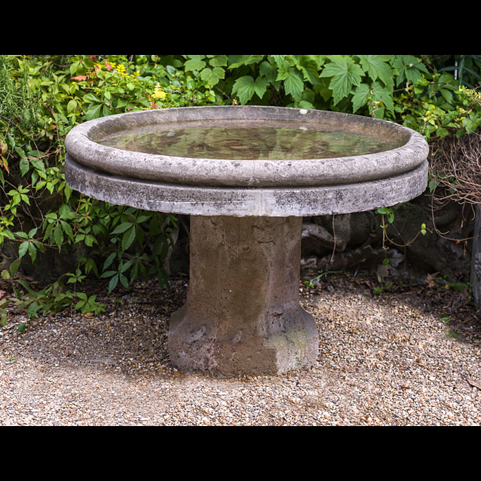 A large garden composition stone bird bath