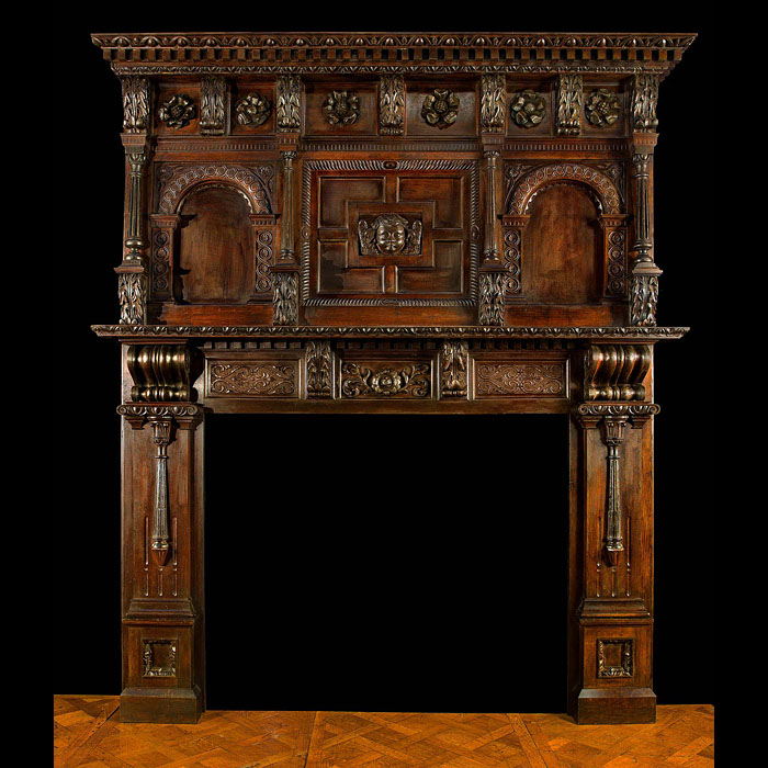 A Tall Carved Tudor Rose Oak Jacobean Revival chimneypiece