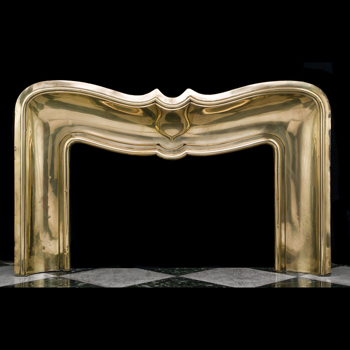 An antique brass French fireplace insert